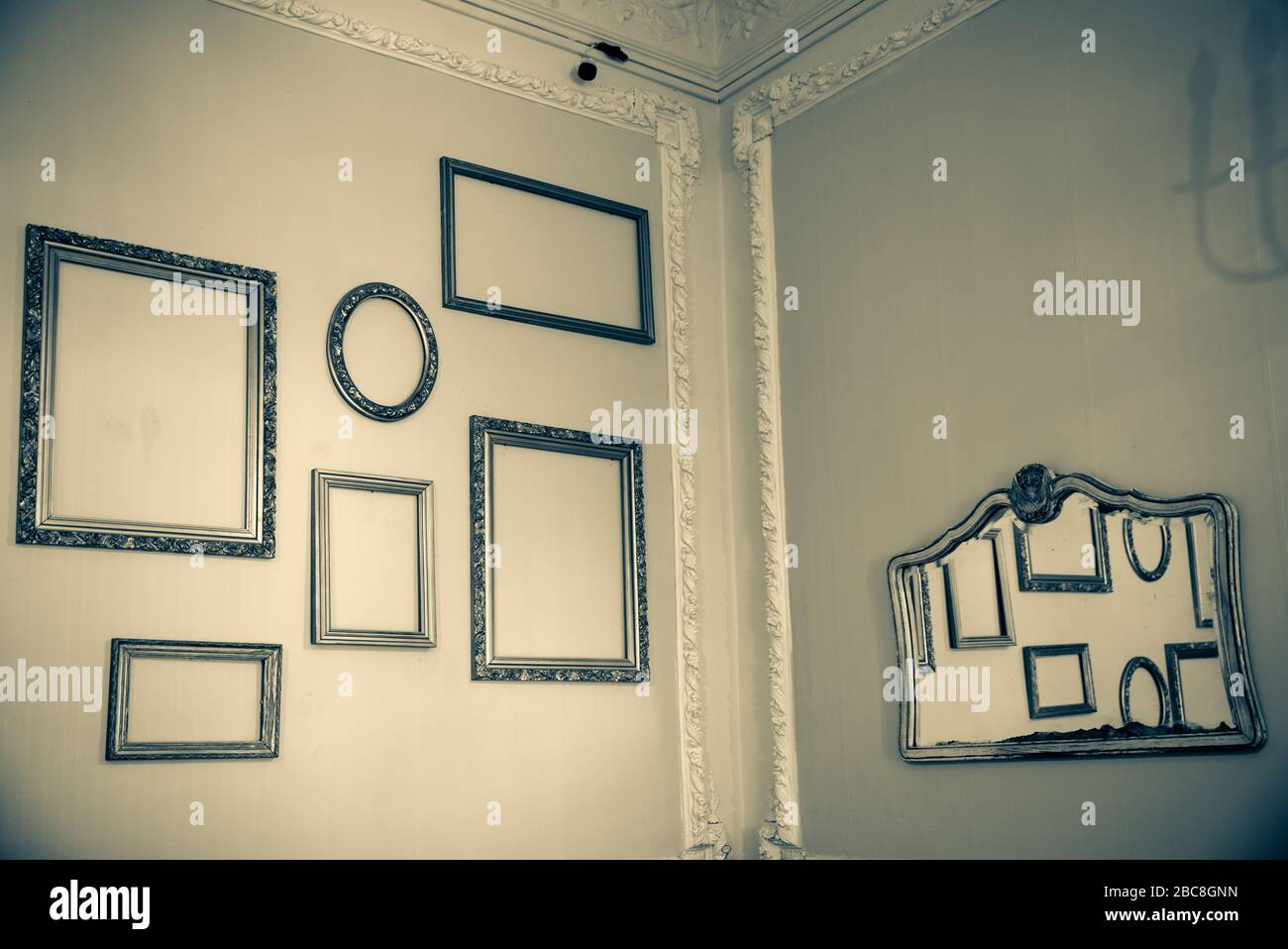 an empty room with empty art frames Stock Photo