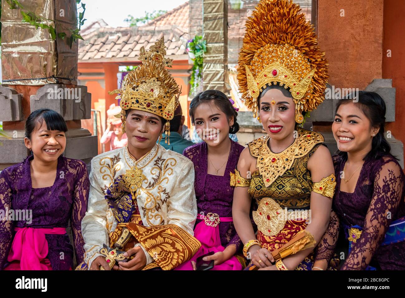 Horizontal portrait of a bride and groom with friends at a Balinese wedding, Indonesia. Stock Photo