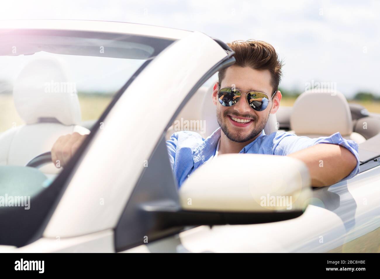Young man driving convertible hi-res stock photography and images - Alamy