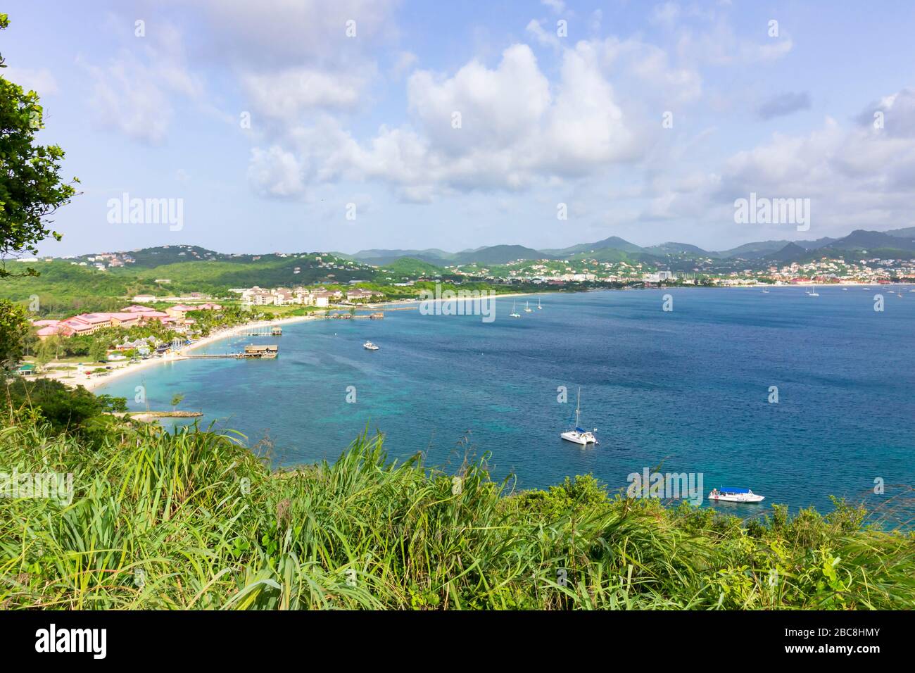 A breathtaking view of the bay the beach, boats and causeway at Gros-Islet from the top of Fort Rodney at Pigeon Island National Landmark, Saint Lucia Stock Photo