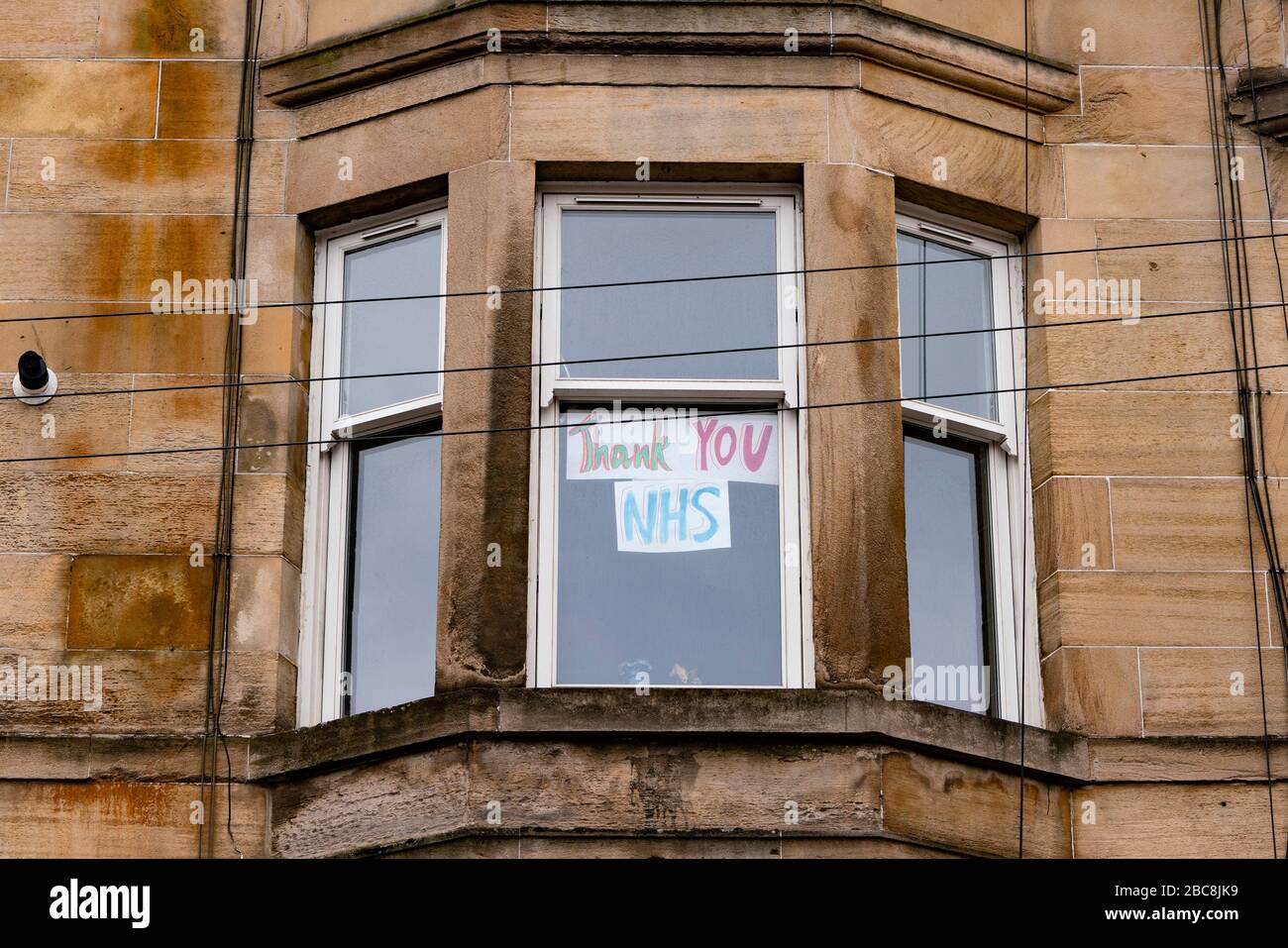 Glasgow, Scotland, UK. 3 April, 2020. Images from the south side of Glasgow at the end of the second week of Coronavirus lockdown. Pictured; hand drawn message in window of flat in Govanhill. Iain Masterton/Alamy Live News Stock Photo