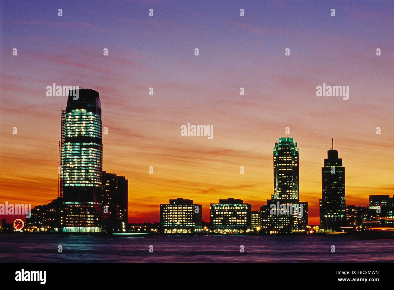 USA. New Jersey. Jersey City skyline with Goldman Sachs Tower at sunset. Stock Photo