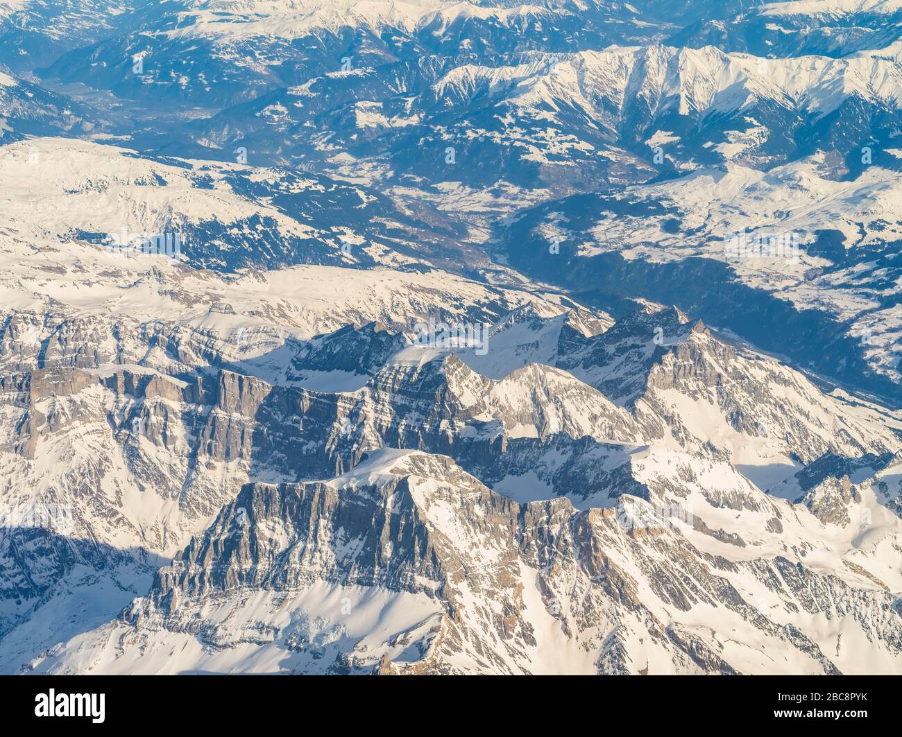 Aerial view, Swiss Alps with snowy mountains Stock Photo