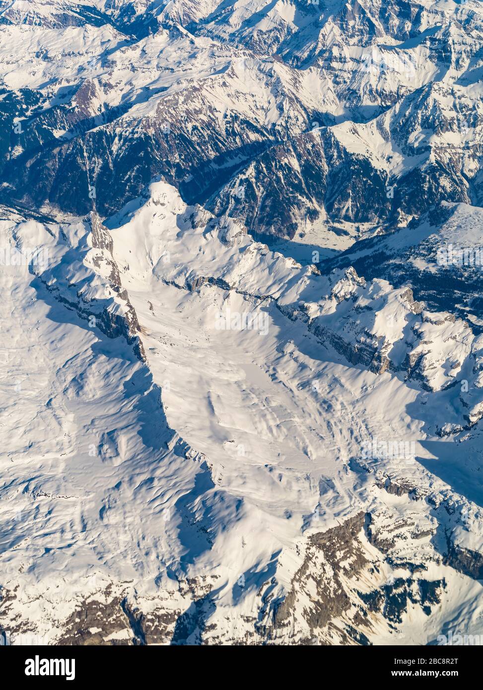 Aerial view, Swiss Alps with snowy mountains Stock Photo