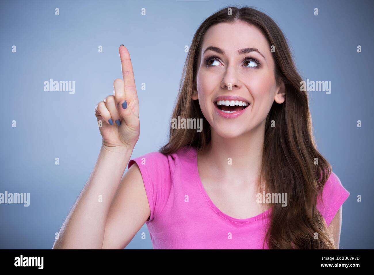 Young woman looking up Stock Photo