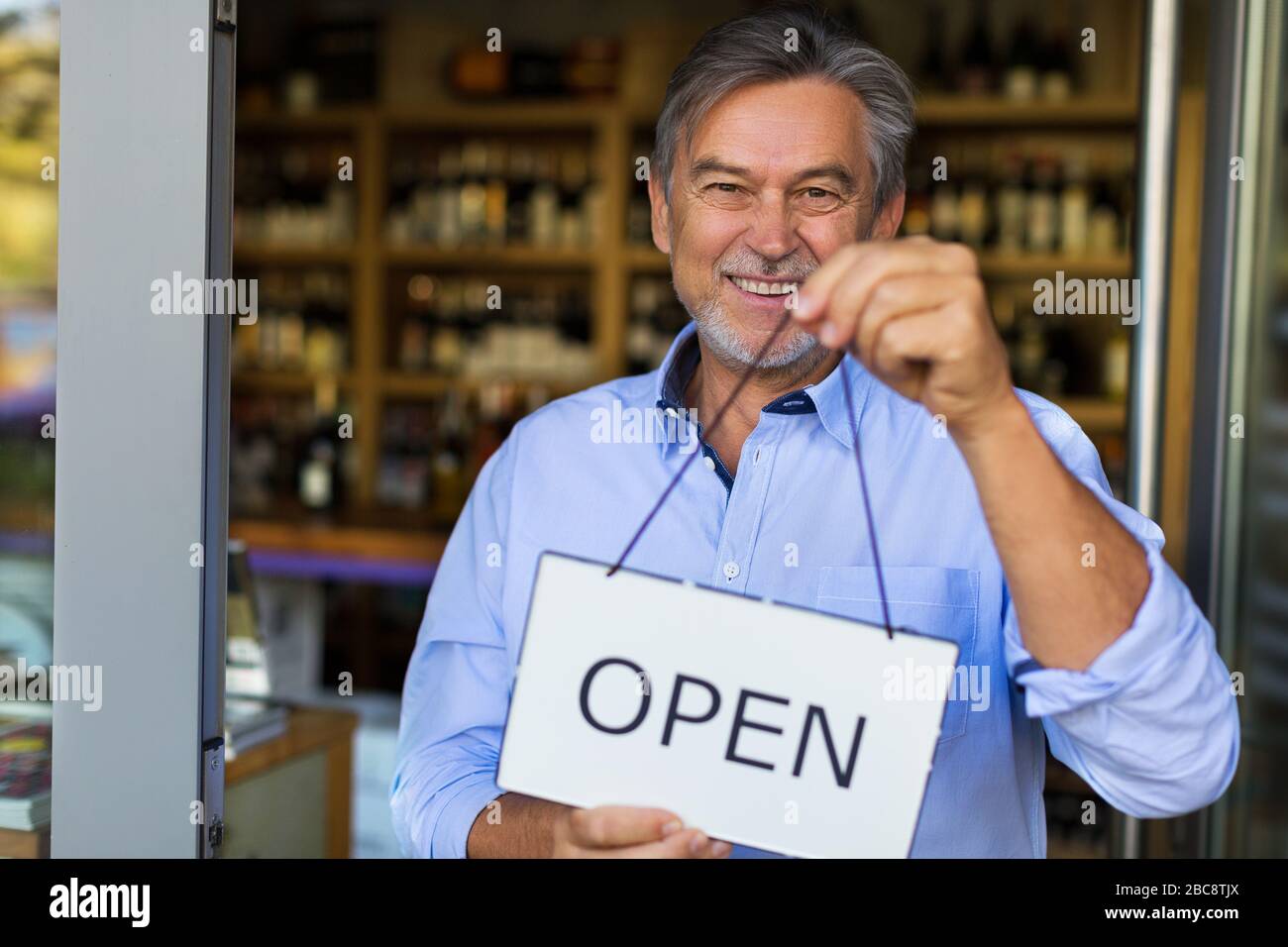 Man working in wine shop Stock Photo