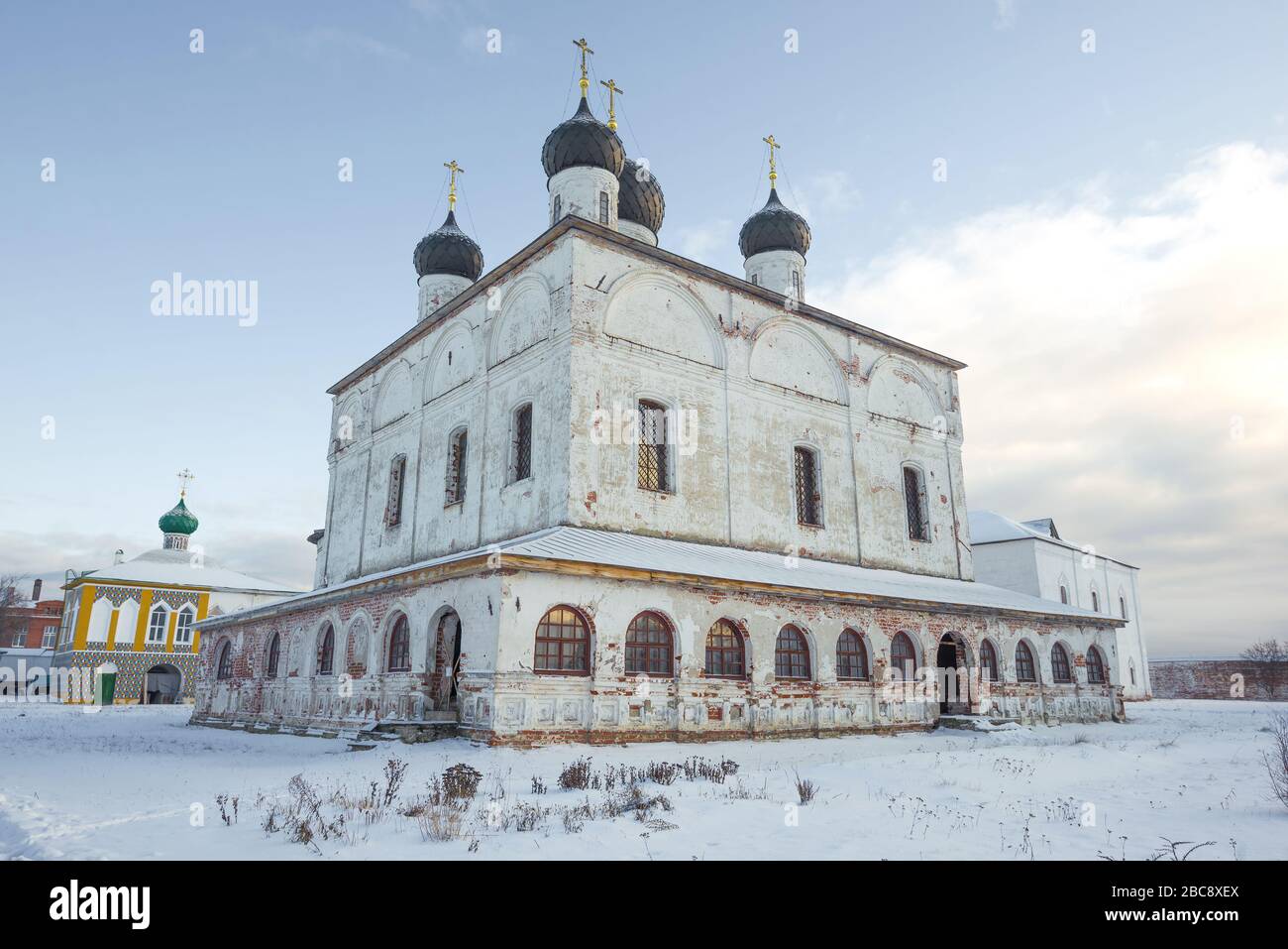 Ancient Trinity Cathedral in the Trinity Makariyevo-Unzhensky monastery on a cloudy January day. Kostroma region. Russia Stock Photo