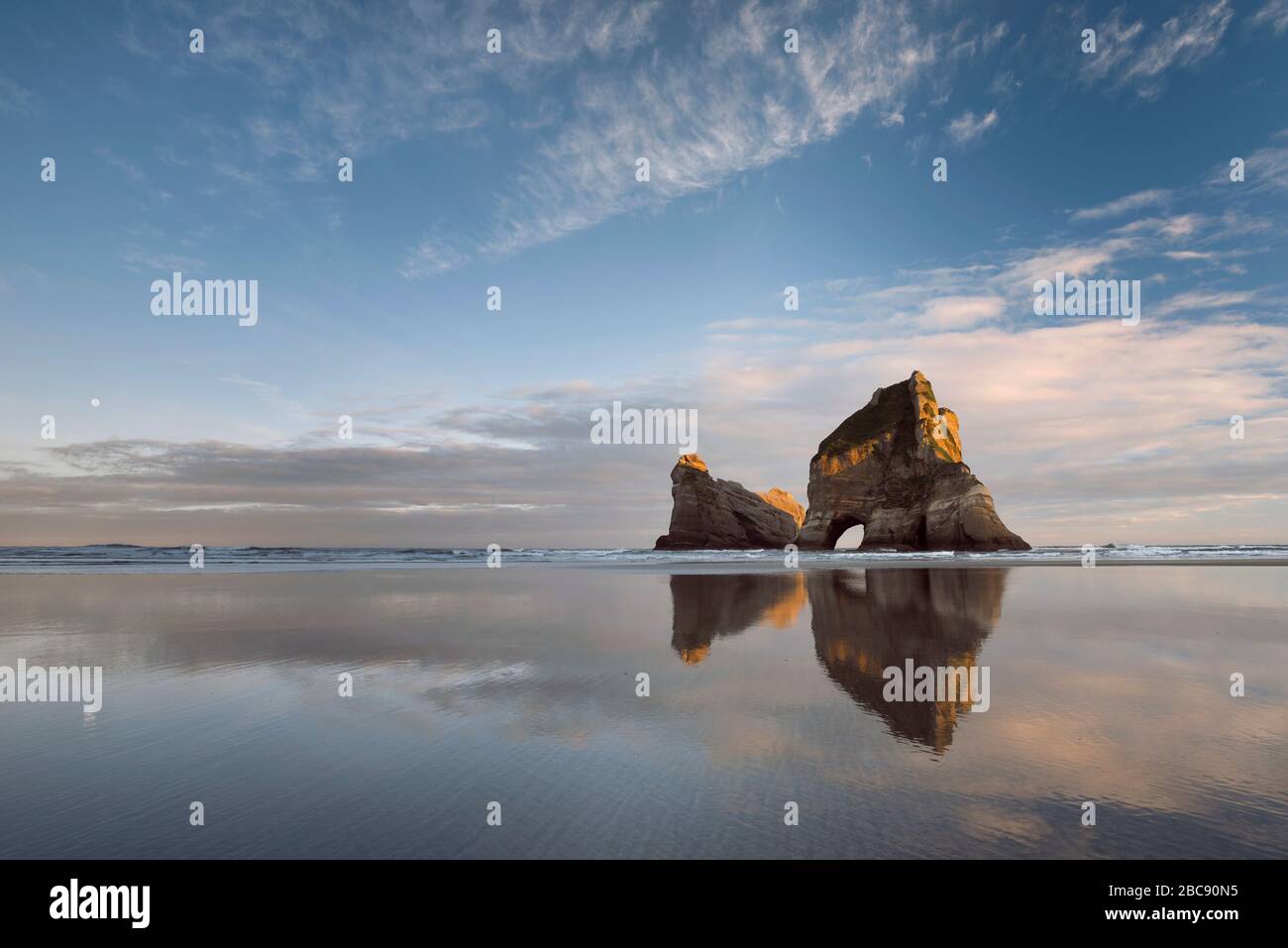 Archway Islands at sunrise with reflection, Wharariki Beach, Golden Bay, Tasman, New Zealand Stock Photo