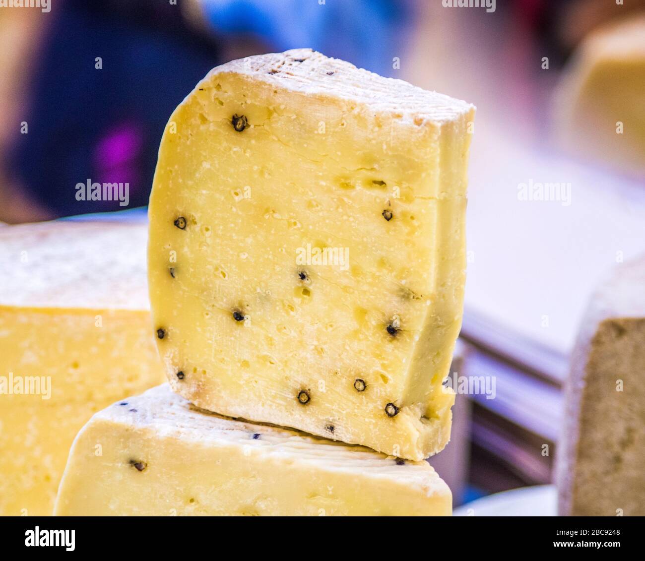 caveaged pecorino cheese with aromatic herbs and black pepper ready to