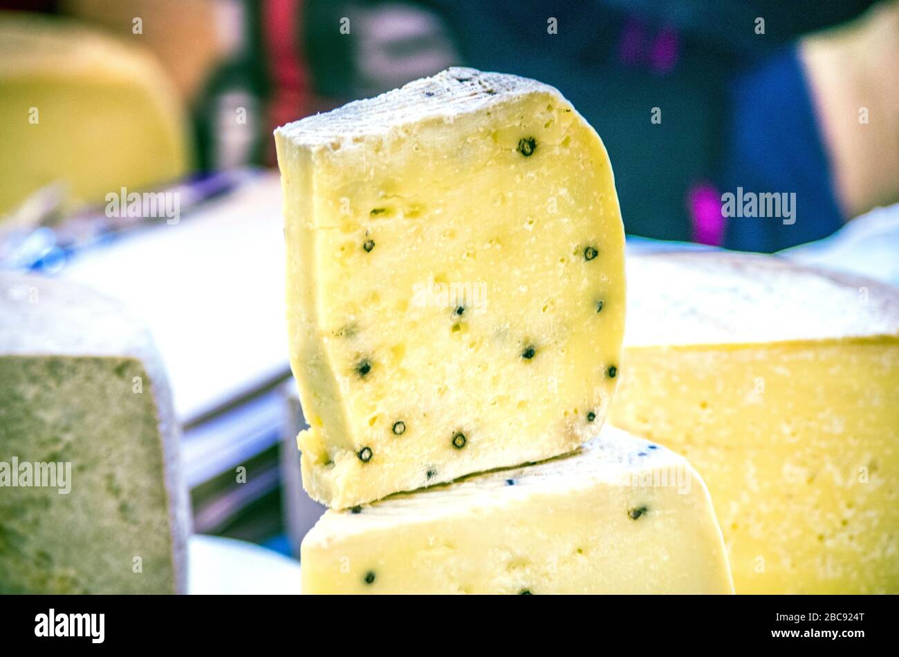 caveaged pecorino cheese with aromatic herbs and black pepper ready to