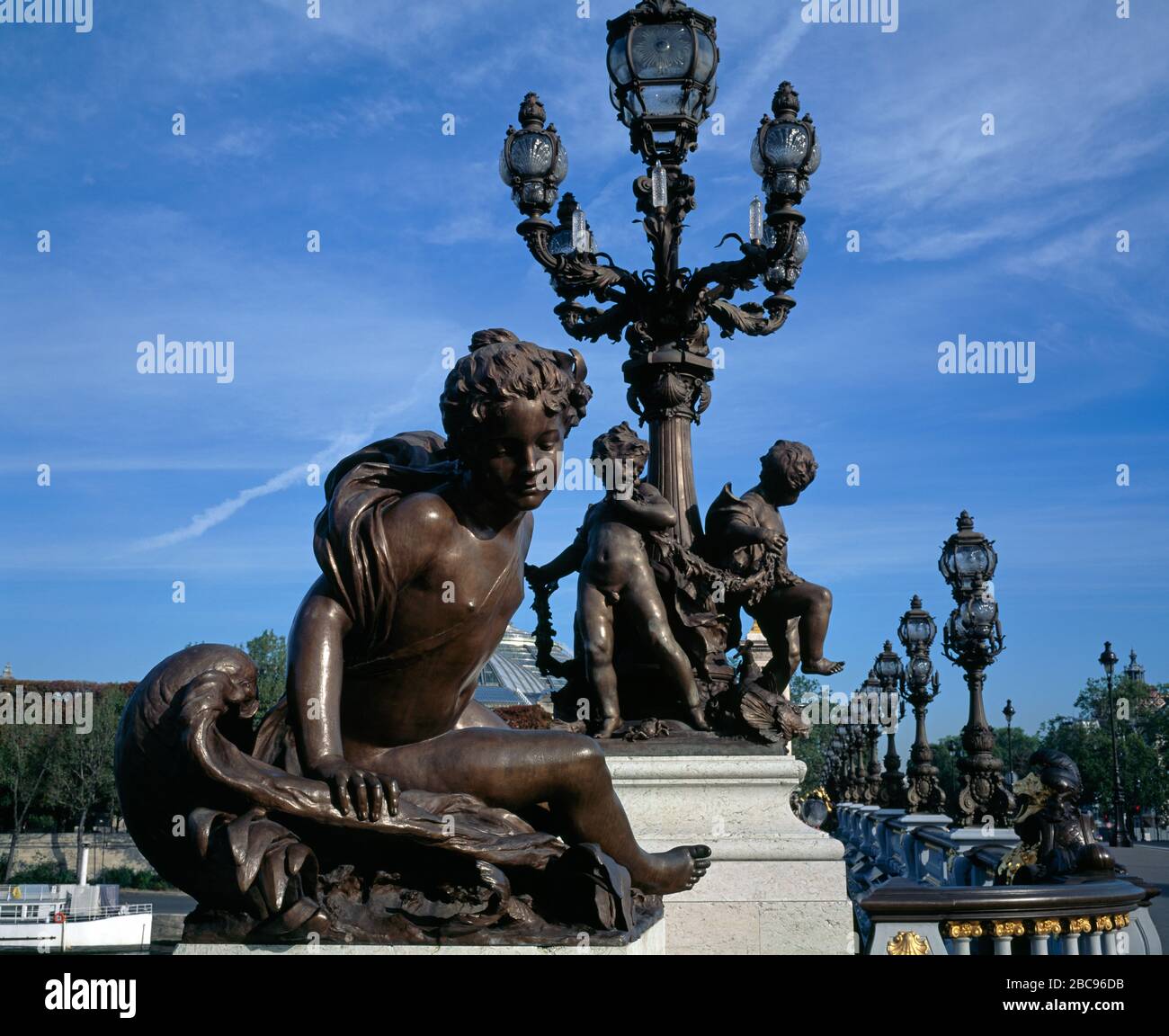 Statue and street lamp on Alexandre III Bridge. Paris, France Stock ...