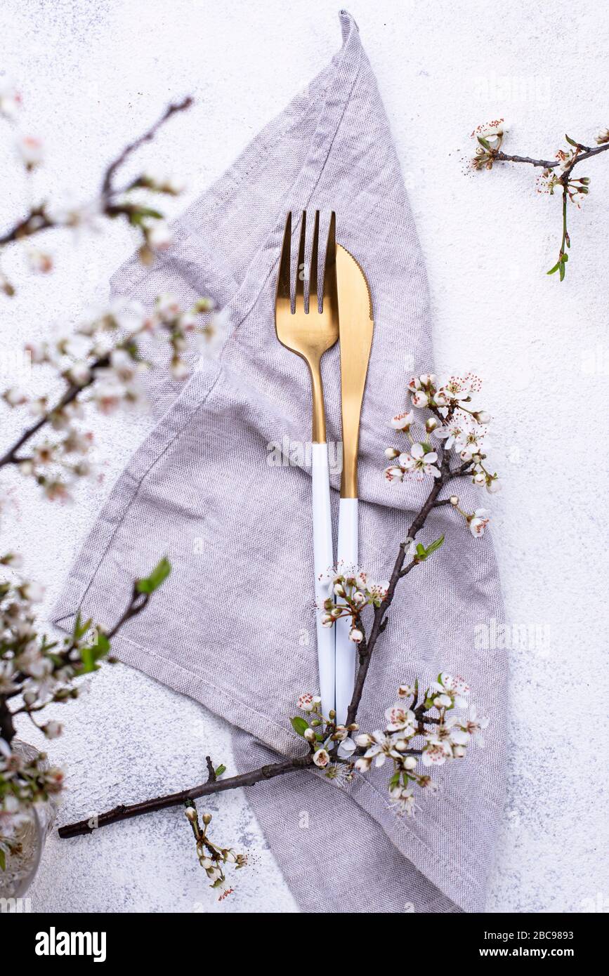 Spring table setting with blooming branch Stock Photo