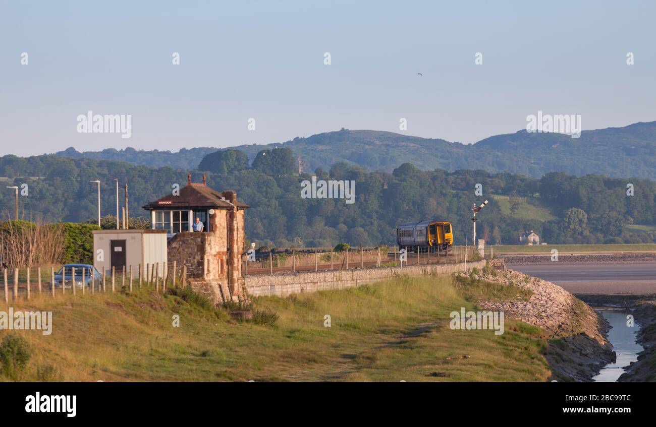 Northern Rail class 156 sprinter train passing Arnside signalbox on the ...