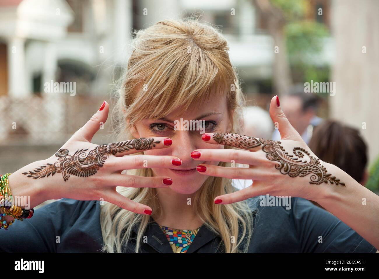 beautiful young women with india hand painting mehendi henna Stock Photo