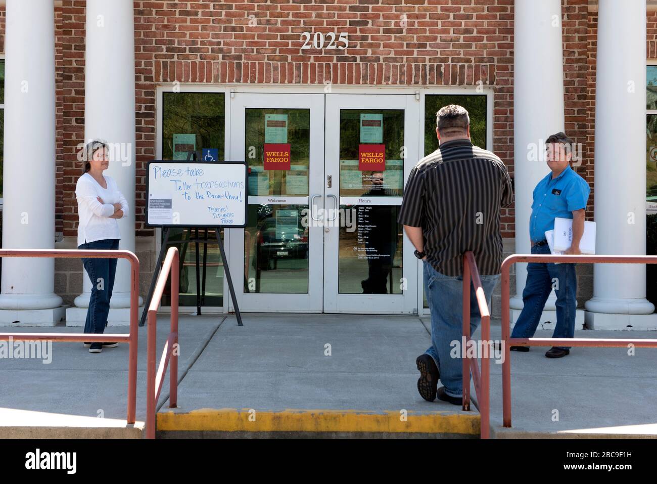 April 3, 2020: Wells Fargo Bank customers keep a safe distance outside a branch office, waiting to be summoned for a pre-arranged appointment with a banking officer. Banks are bracing themselves for wave of applications for the crisis small business loan program set up in the $2 trillion federal stimulus as a result of the Covid-19 pandemic. Through the process was expected to begin today, many banks say theyÃre not ready. Credit: Robin Rayne/ZUMA Wire/Alamy Live News Stock Photo