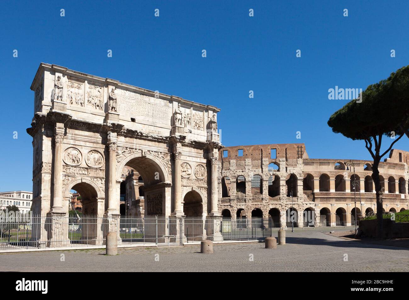 The Arch of Constantine (Arco di Costantino).  Triumphal arch and Colosseum on background. Rome, Italy Stock Photo
