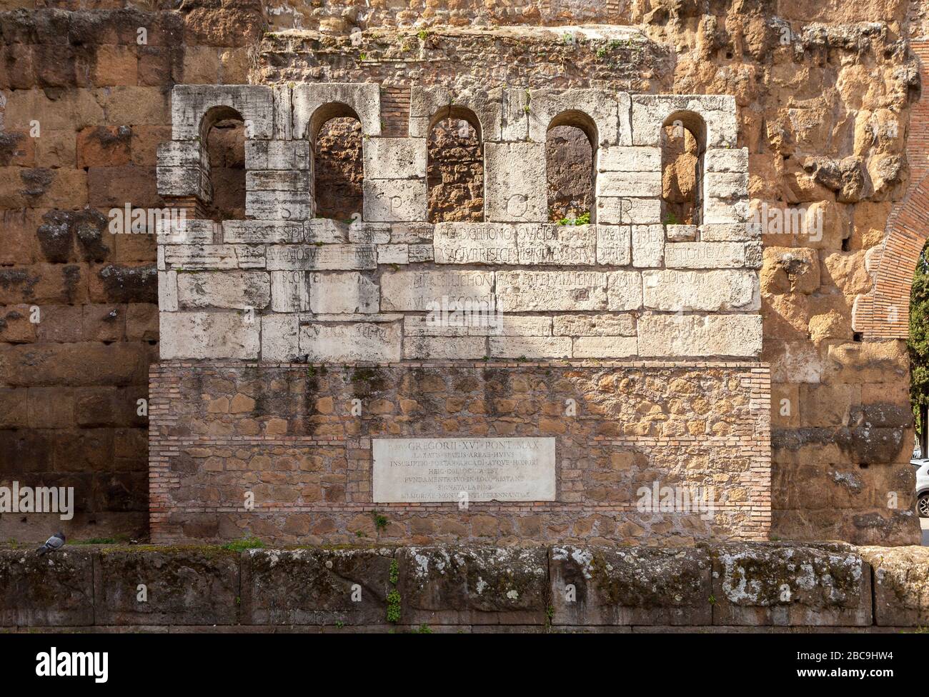 Remains of Honorius' gate near The Porta Maggiore (Larger Gate), or Porta Prenestina, is one of the eastern gates in Aurelian Walls of Rome, Italy. Stock Photo
