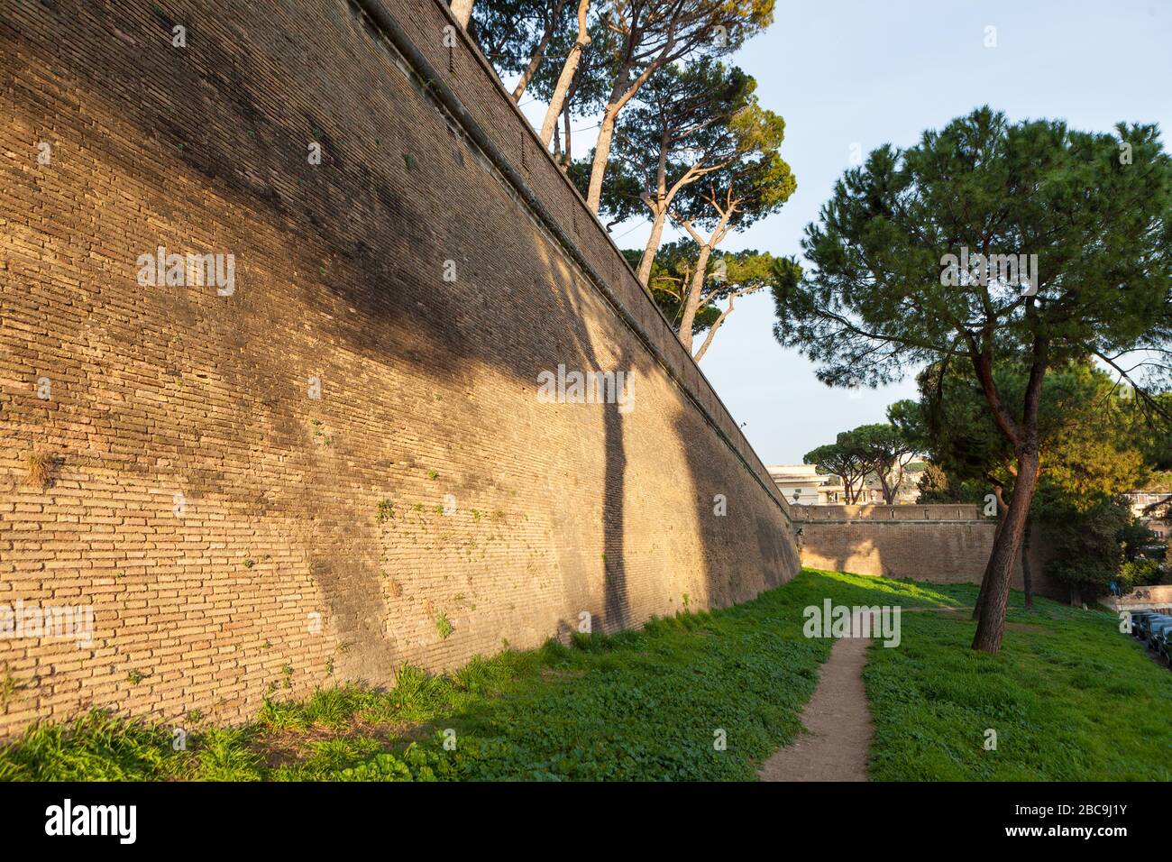 Walls of Vatican City and the dome of the Papal Basilica of St. Peter. Rome, Italy Stock Photo