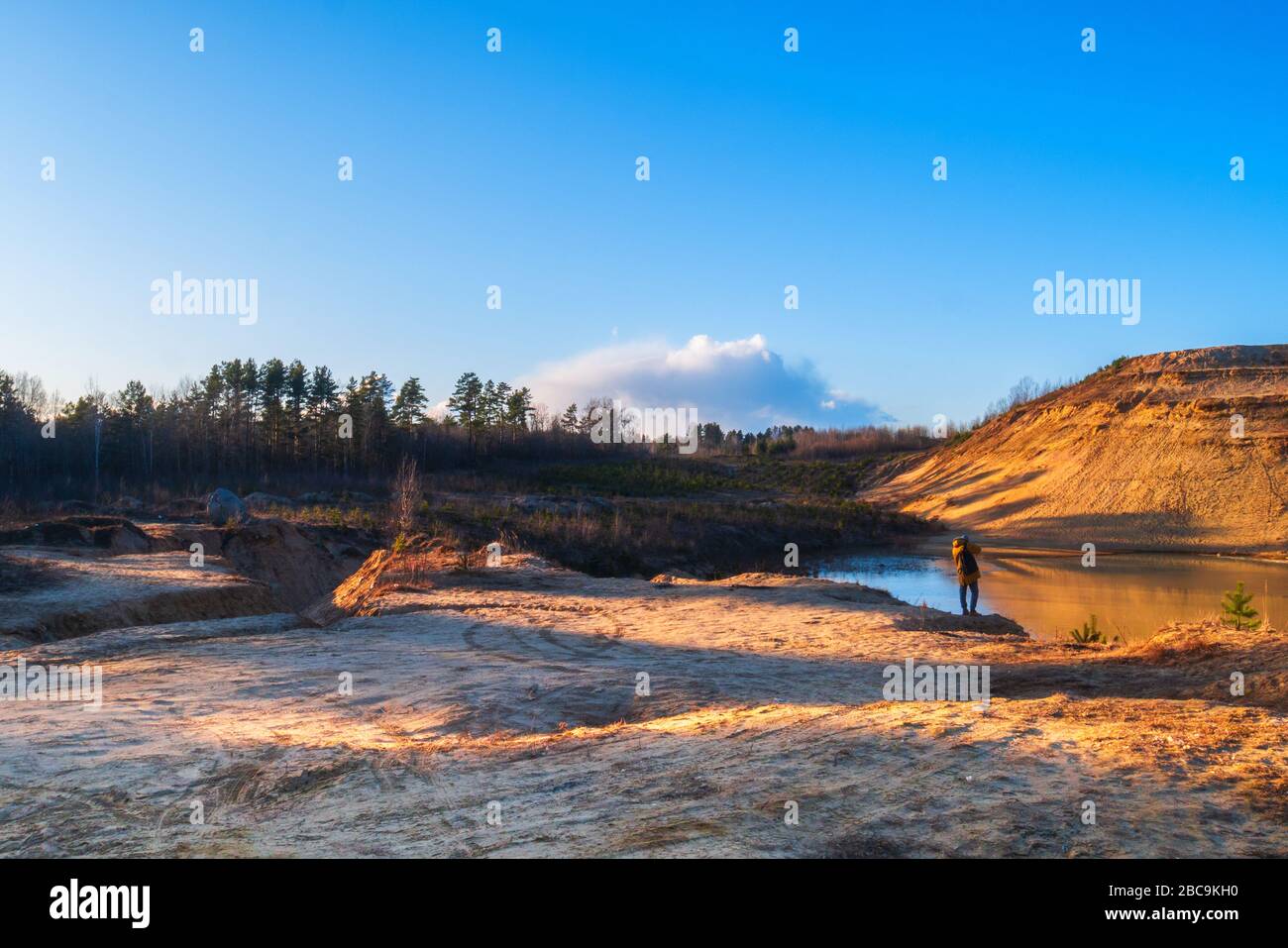 Natural sunset against the backdrop of forests. Stock Photo