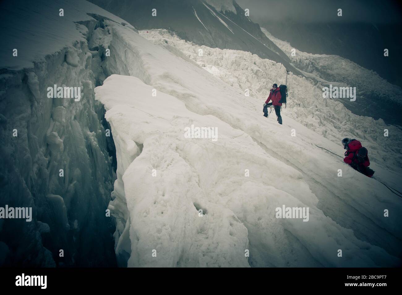 The Trans-Alay Range. Pamir Mountain System. Two climbers with belay ...