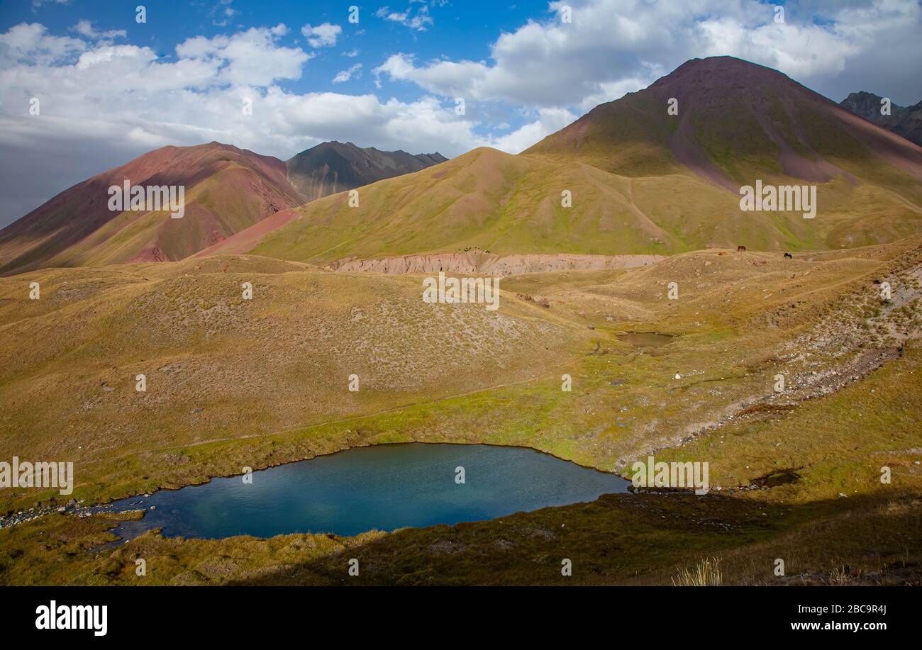 Kyrgyz nature. The Trans-Alay Range. Pamir Mountain System. The lake between mountains. Stock Photo