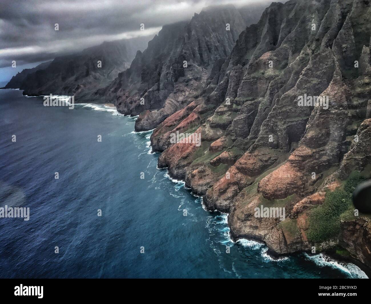 Famous coast from helicopter during rainy day with spectacular green ...