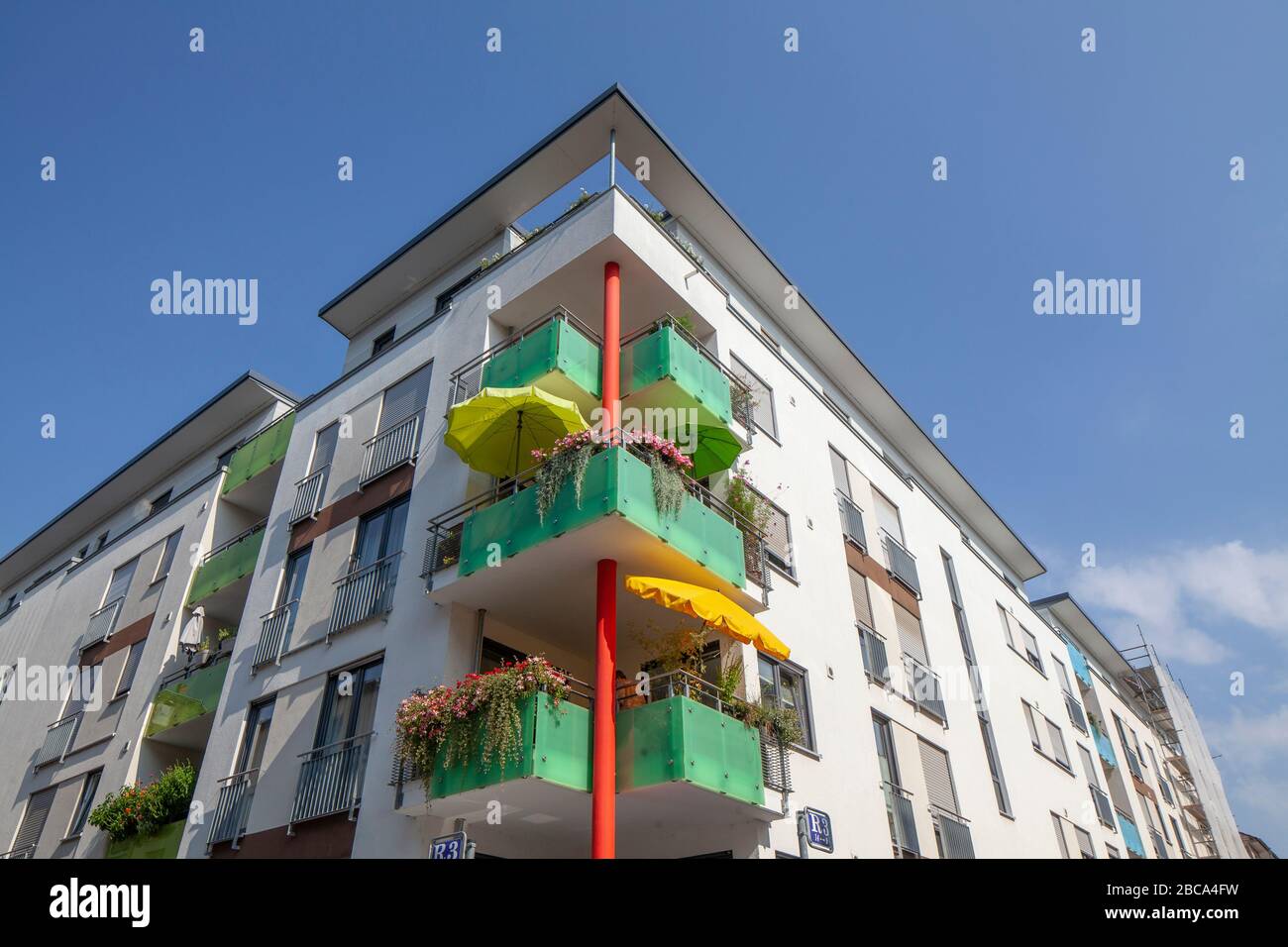 Modern residential building, colorful balconies with parasols, Mannheim, Baden-Württemberg, Germany, Europe Stock Photo