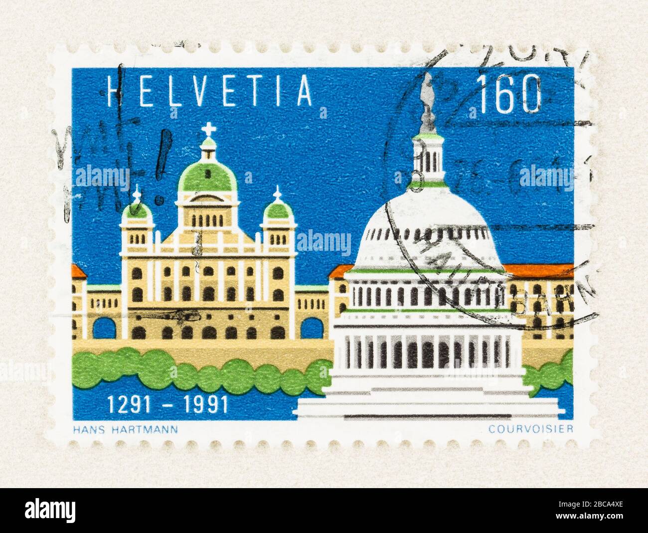 SEATTLE WASHINGTON - April 3, 2020: Close up of Swiss postage stamp  featuring Swiss Parliament and US Capital Building. Scott # 888. Stock Photo