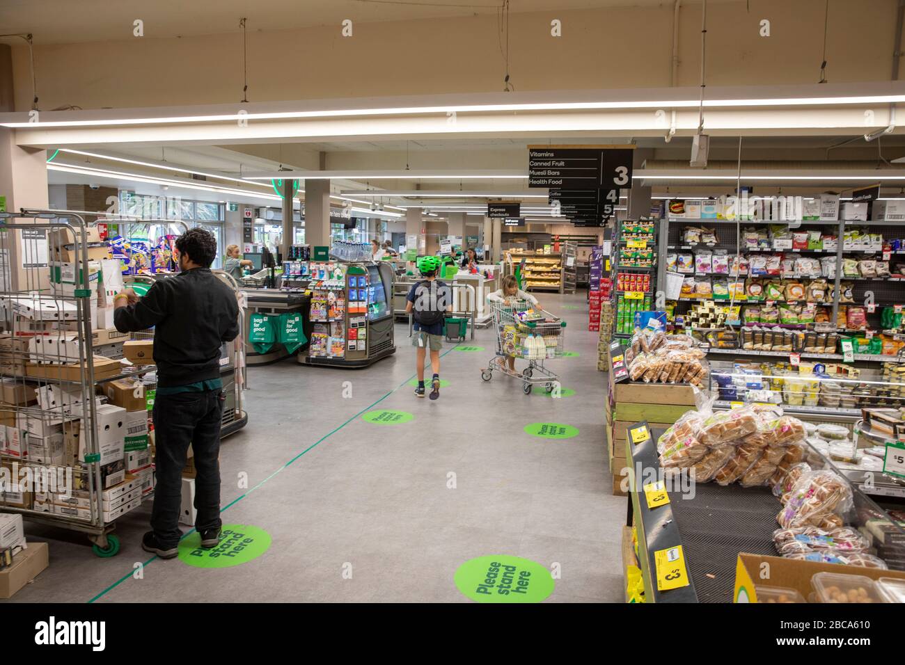 Sydney, Australia. Saturday 4th April 2020.  Australian woolworths supermarkets introduce floor marking for customers to stand here whilst queueing at checkouts. This helps customers remain 1.5m metres away from each other as required by the Australian Government.  Credit Martin Berry/Alamy Live News Stock Photo