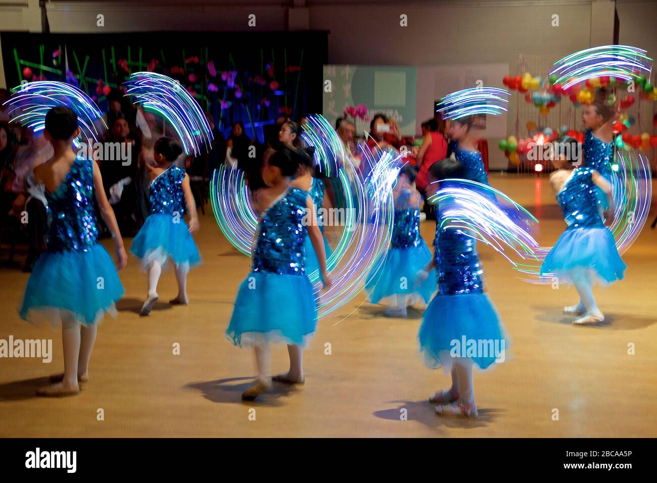 Motion blur of dancing by teenagers on Mid Autumn Moon Festival at Toronto Chinese Community Centre Stock Photo