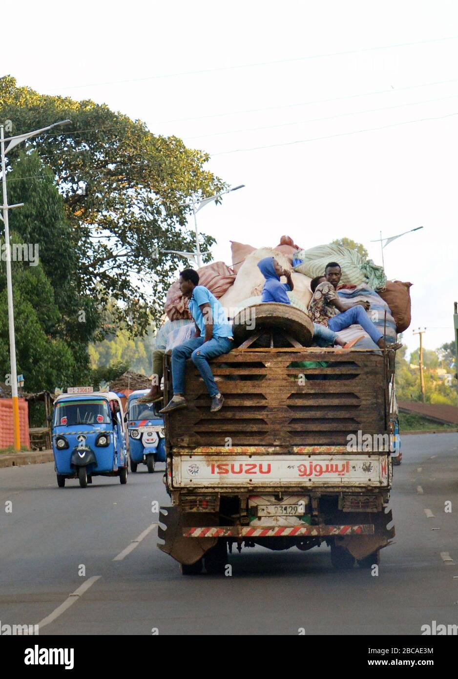 Ethiopian men on the back of an Isuzu truck in Oromia, Ethiopia. Stock Photo