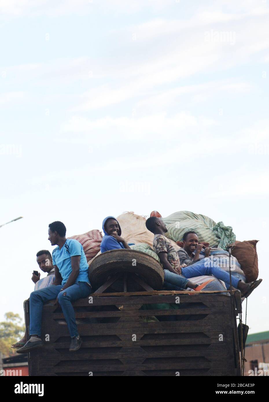 Ethiopian men on the back of an Isuzu truck in Oromia, Ethiopia. Stock Photo