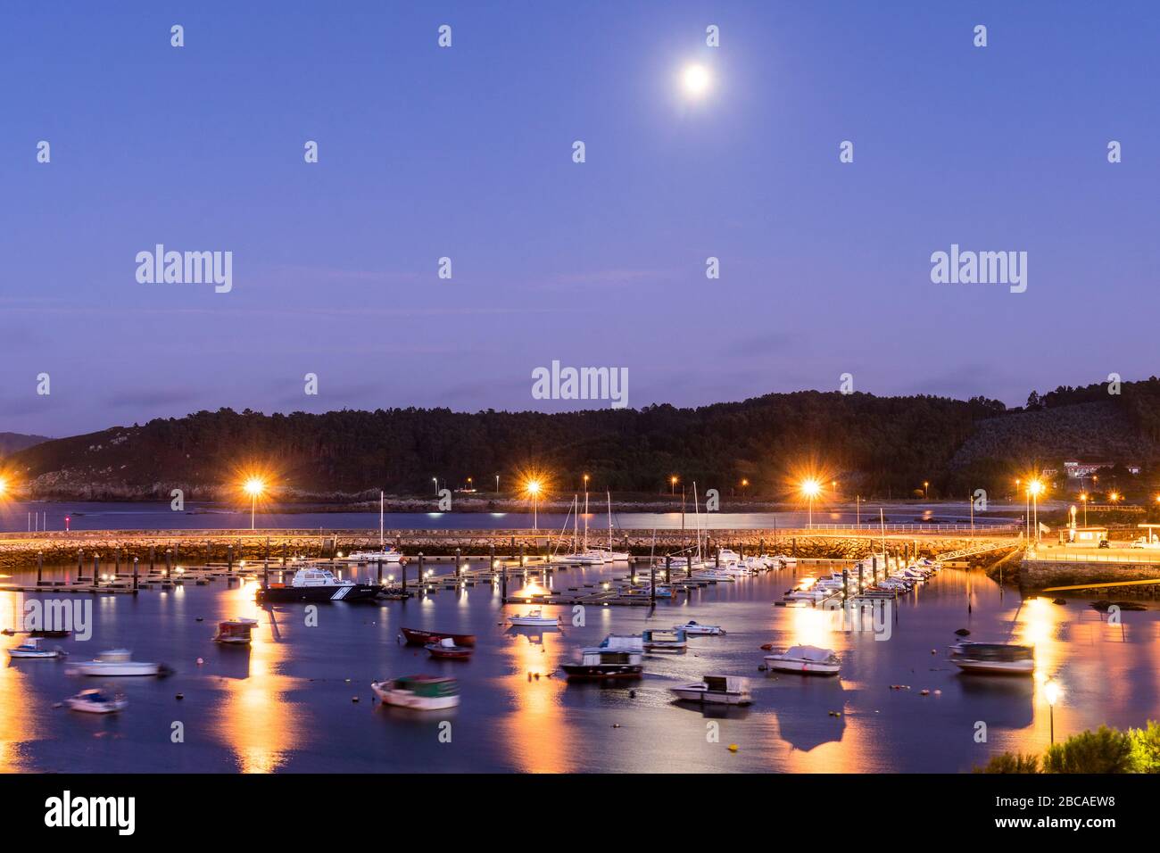 Spain, north coast, Galicia, Costa da Morte, Muxia, harbor at night, moonlight Stock Photo