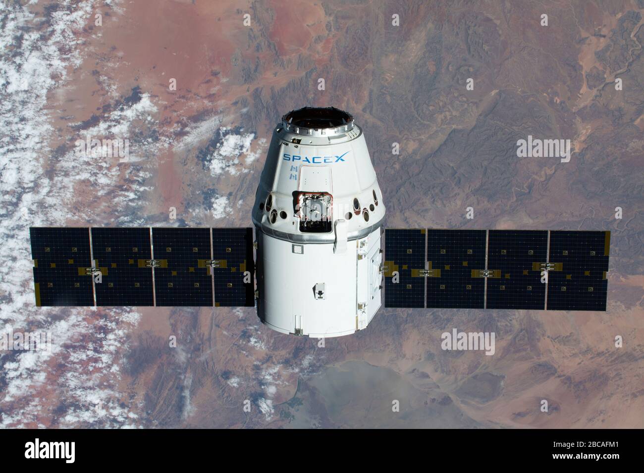 ISS - 09 Mar 2020 - The SpaceX Dragon resupply ship is pictured approaching the International Space Station as both spacecraft were soaring 267 miles Stock Photo