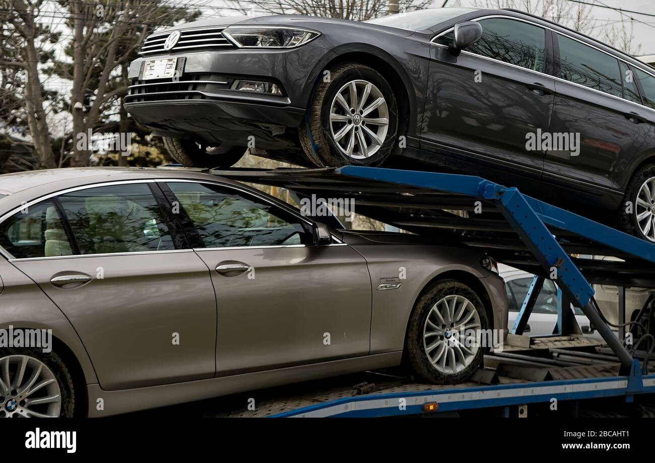 Bucharest, Romania - March 02, 2020: A BMW 520d car and a Volkswagen Passat  B8 Highline Variant are transported on a trailer in Bucharest Stock Photo -  Alamy
