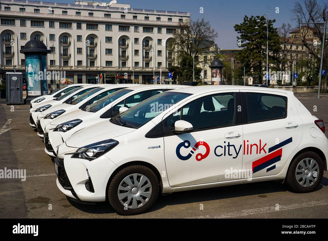 Bucharest, Romania - March 30, 2020: Several Toyota Yaris Hybrid cars belonging to the Romanian renting car service Citylink are parked waiting for cu Stock Photo