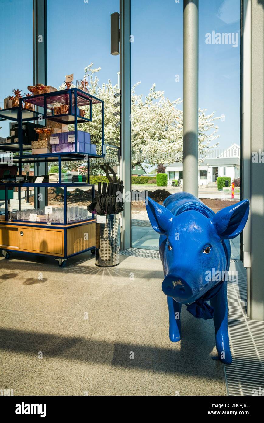 Sweden, Southern Sweden, Ahus, home of the Absolut vodka distillery, interior of The Absolut Experience tour center, sculpture of the happy piggy, hap Stock Photo