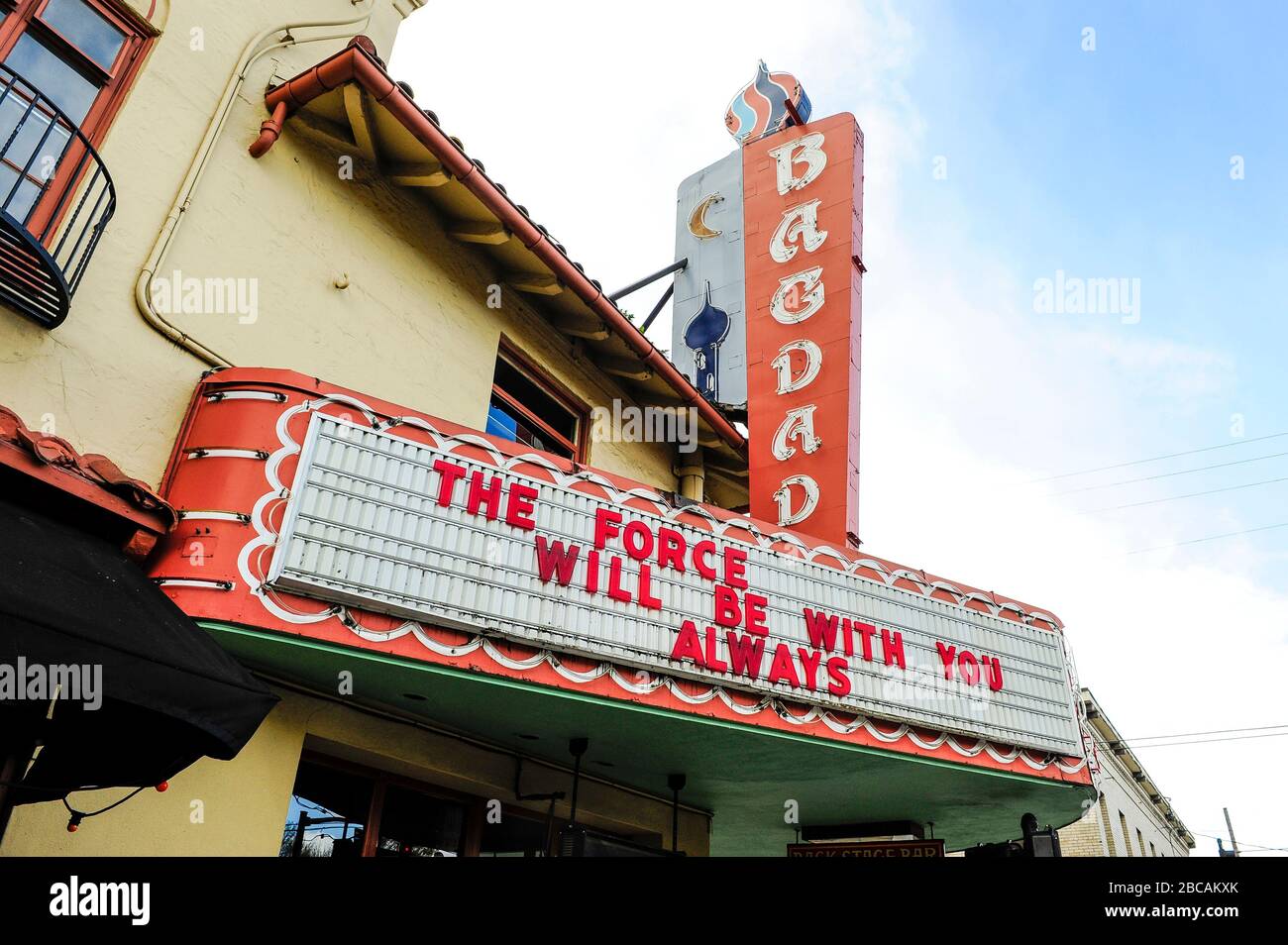 Marquee of McMenamin's Bagdad Theater in Portland, Oregon, USA, reflecting Oregon's Mandatory Stay at Home order in place during the Covid-19 Coronavirus outbreak in the USA on 28th March, 2020. Photo ©Anthony Pidgeon Stock Photo