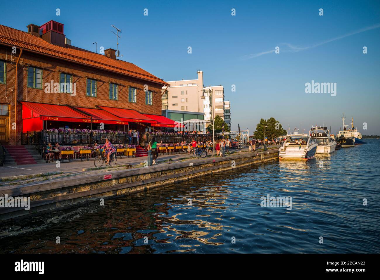 Sweden, Vastmanland, Vasteras, waterfront cafes of the Munkangen harborfront Stock Photo