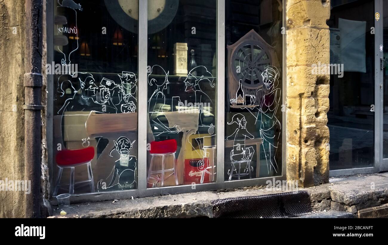 Window in front of restaurant in the Vieux Lyon district in autumn. Lyon has been a UNESCO World Heritage Site since 1998. Stock Photo