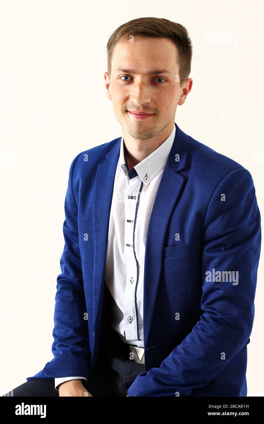 Handsome smiling man in suit looking in camera Stock Photo - Alamy