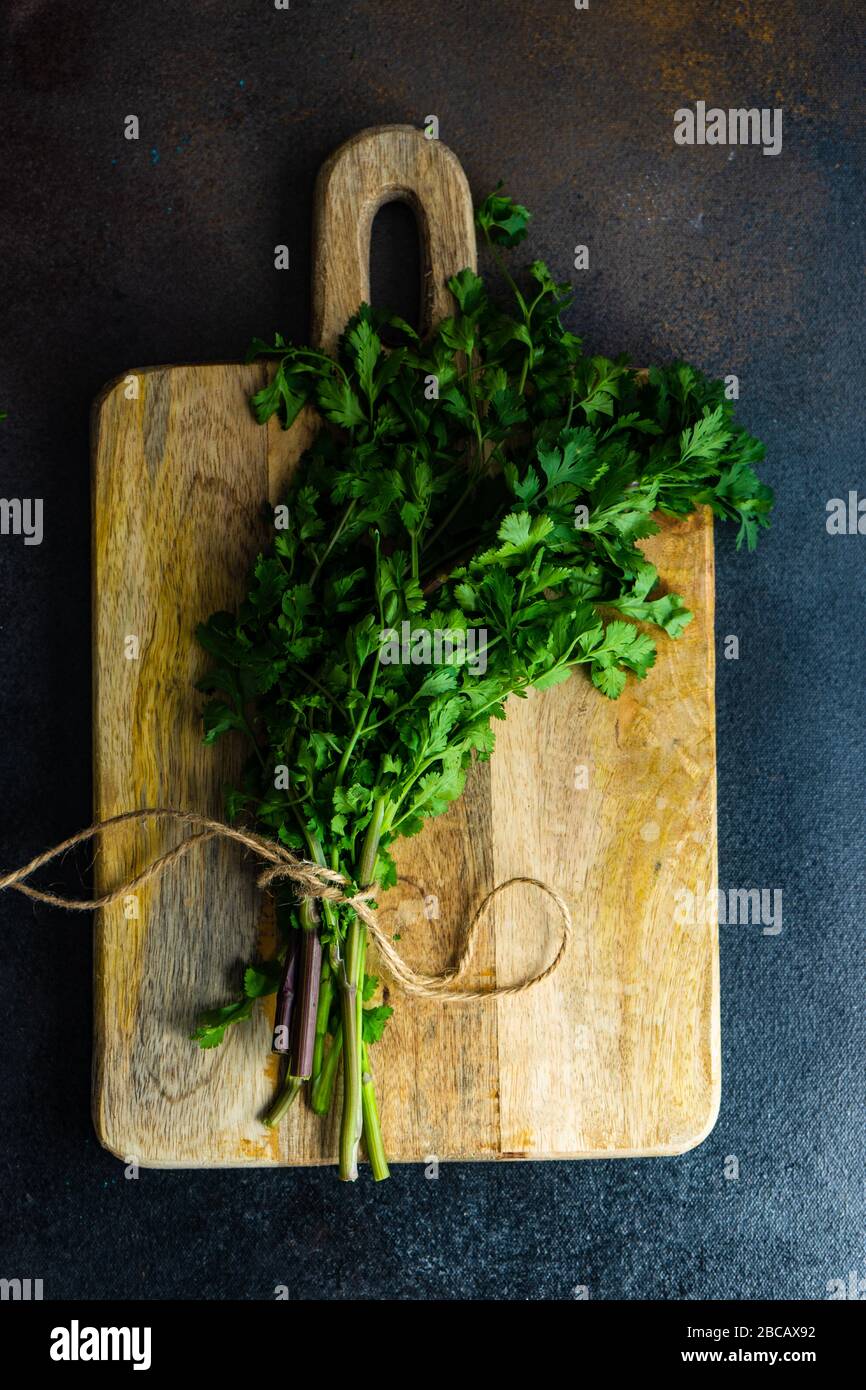 Coriander Leaves and Herb Chopper on a Wooden Board on a White Marbled Work  Top Stock Image - Image of handed, herb: 172190475