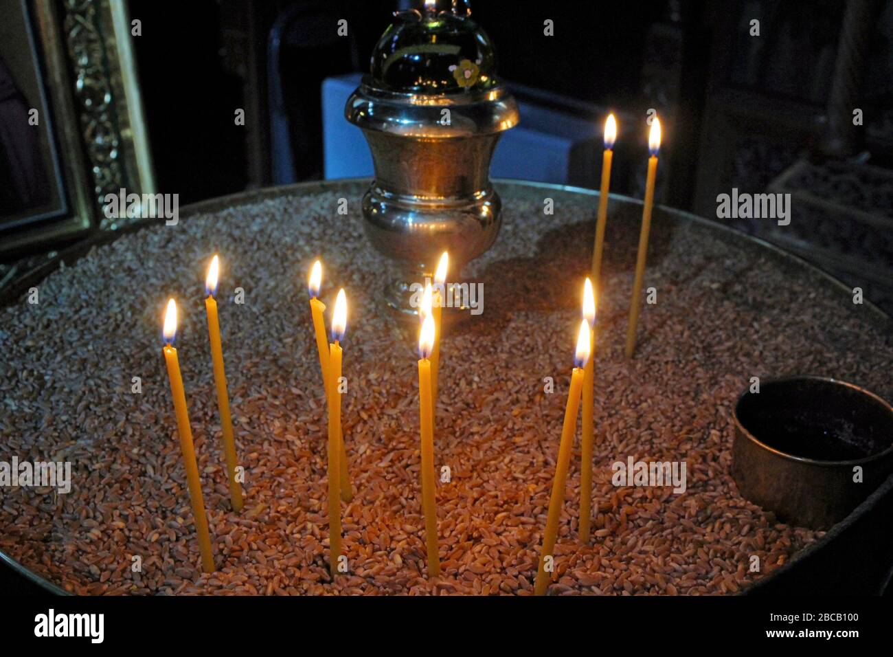 Lighting candles inside a Greek orthodox church Stock Photo - Alamy