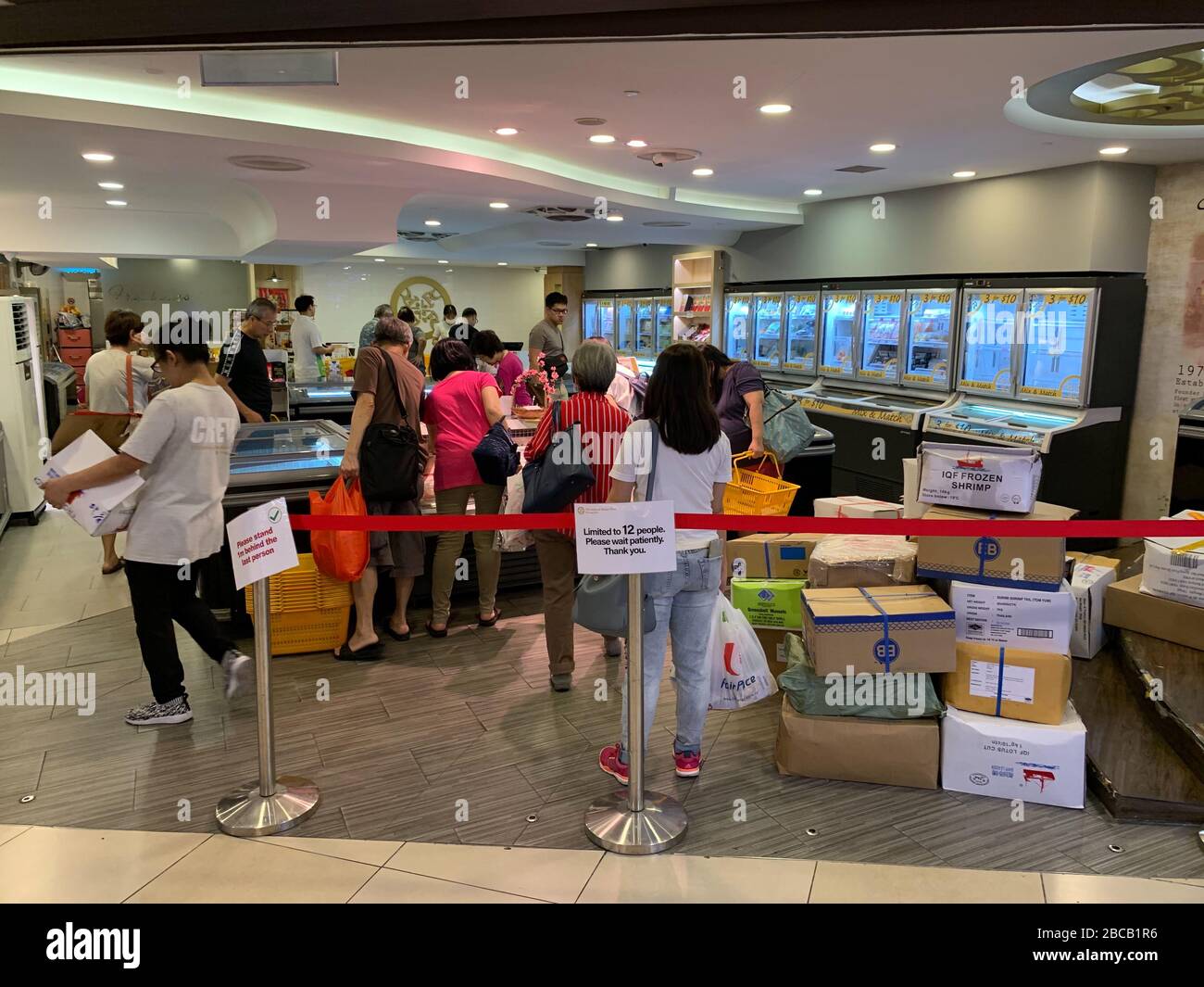 A sign indicates a restriction on the number of people allowed in a