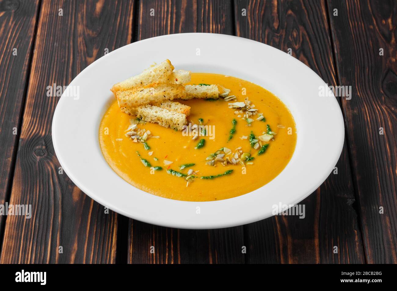 Aubergine soup puree with pumpkin seed and crouton Stock Photo