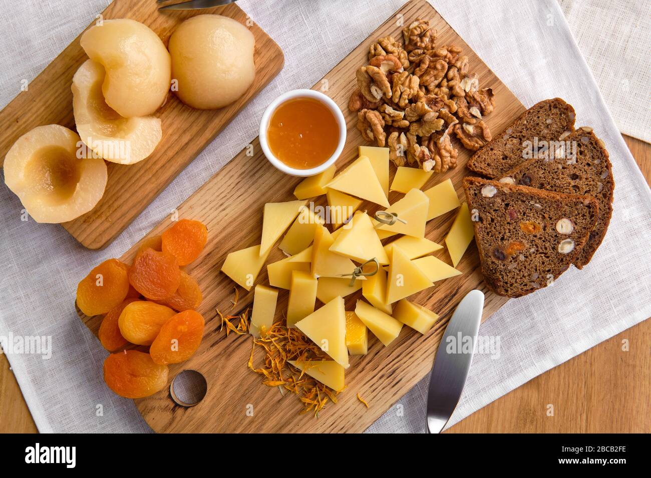 Overhead view of set of various appetizers for wine cheese, walnuts