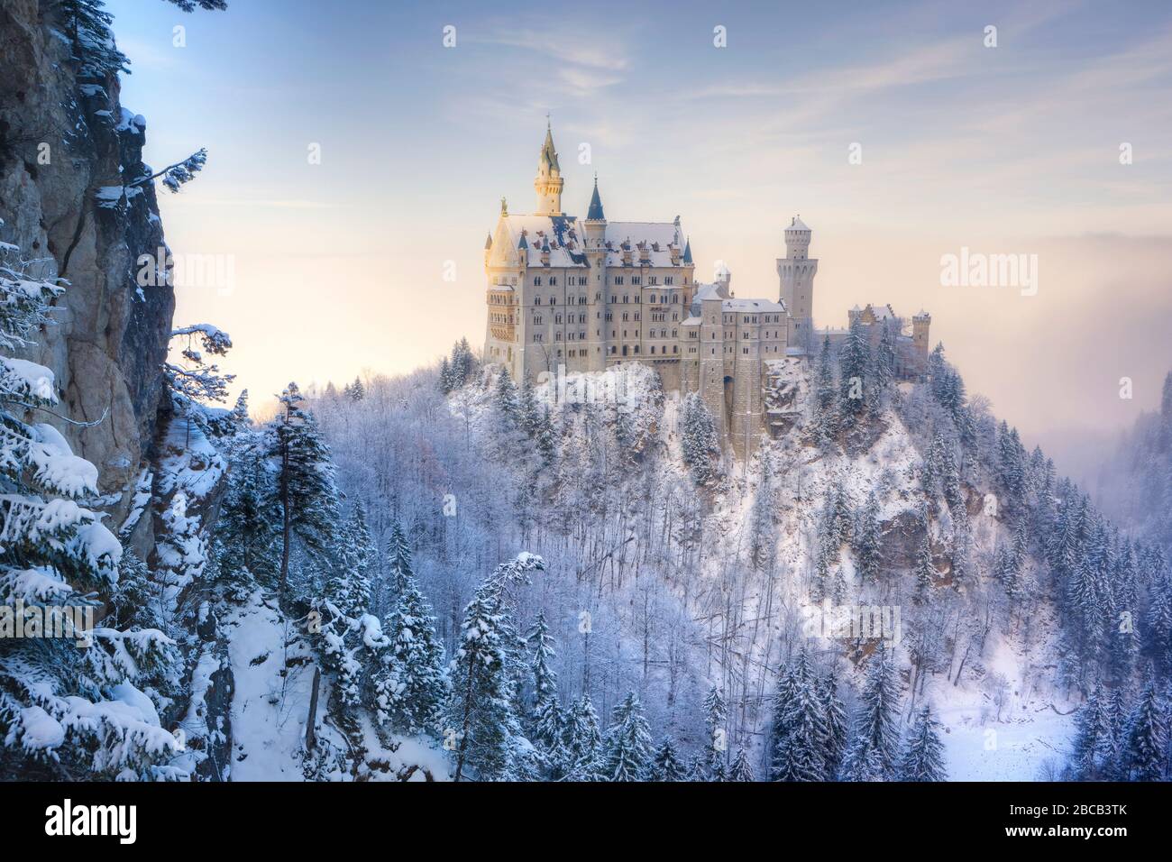snow-covered-landscape-with-neuschwanstein-castle-hi-res-stock