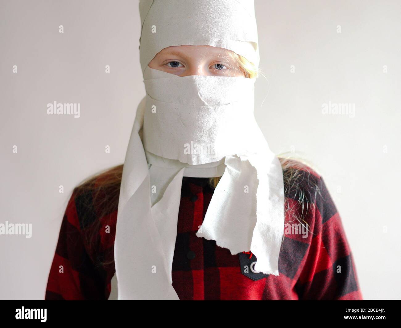 Funny Photo Quarantined Due To An Epidemic Of Coronavirus Girl In A Mask From Toilet Paper Posing On A Gray Background Stock Photo Alamy