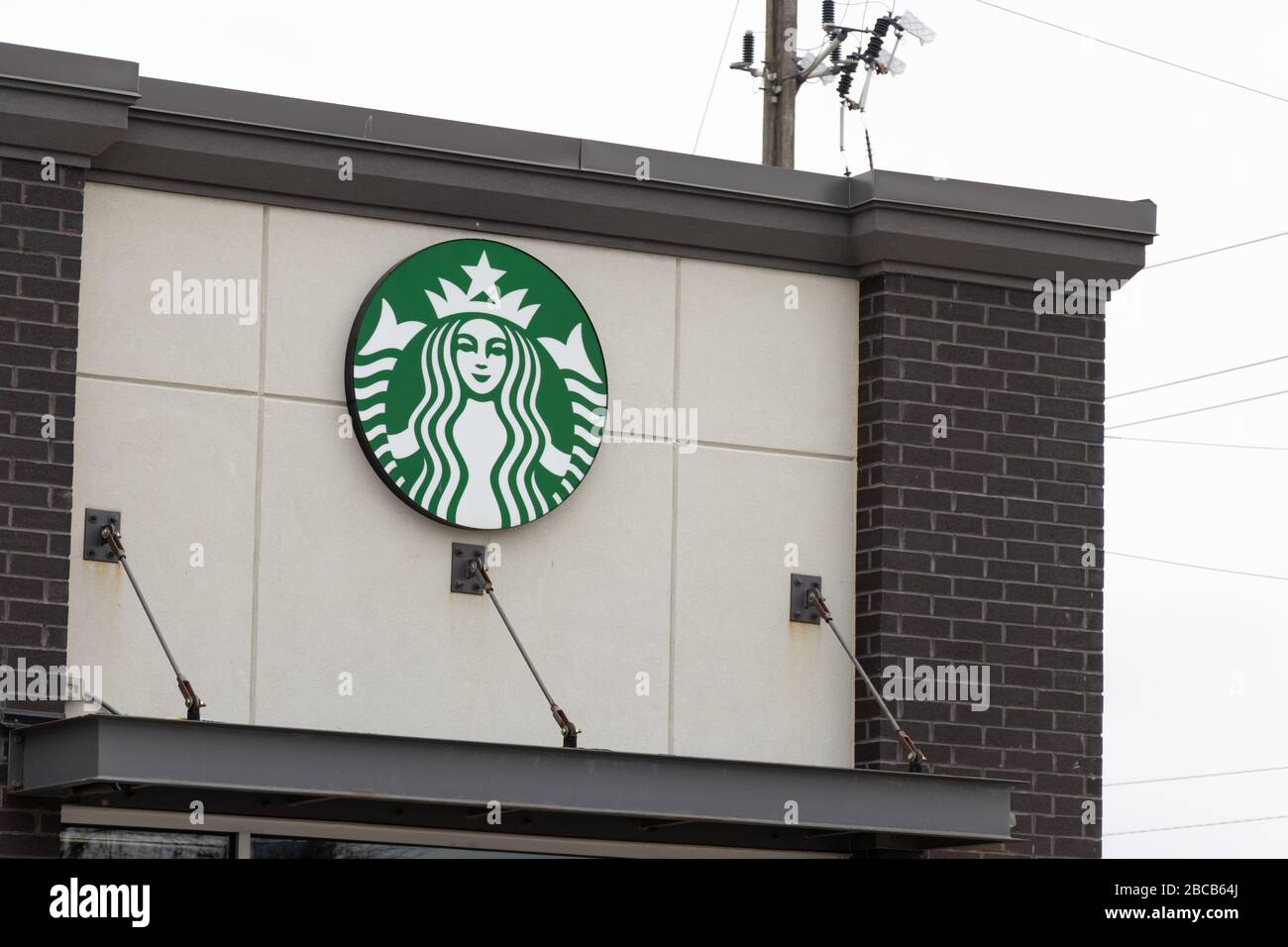 Starbucks Coffee logo on a sign at a newly opened location. Stock Photo