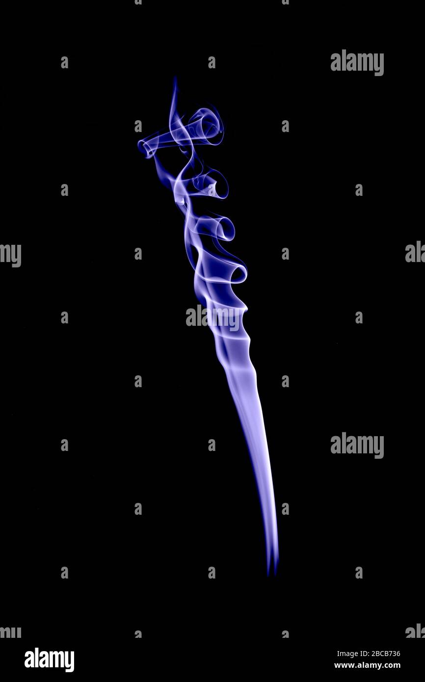 colored smoke shapes with black background Stock Photo